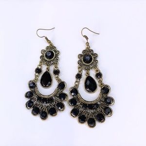 Gold and black dangling earrings